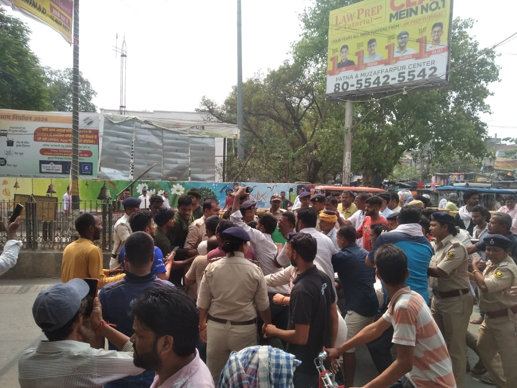 a group of people standing in a crowd in chapra chok